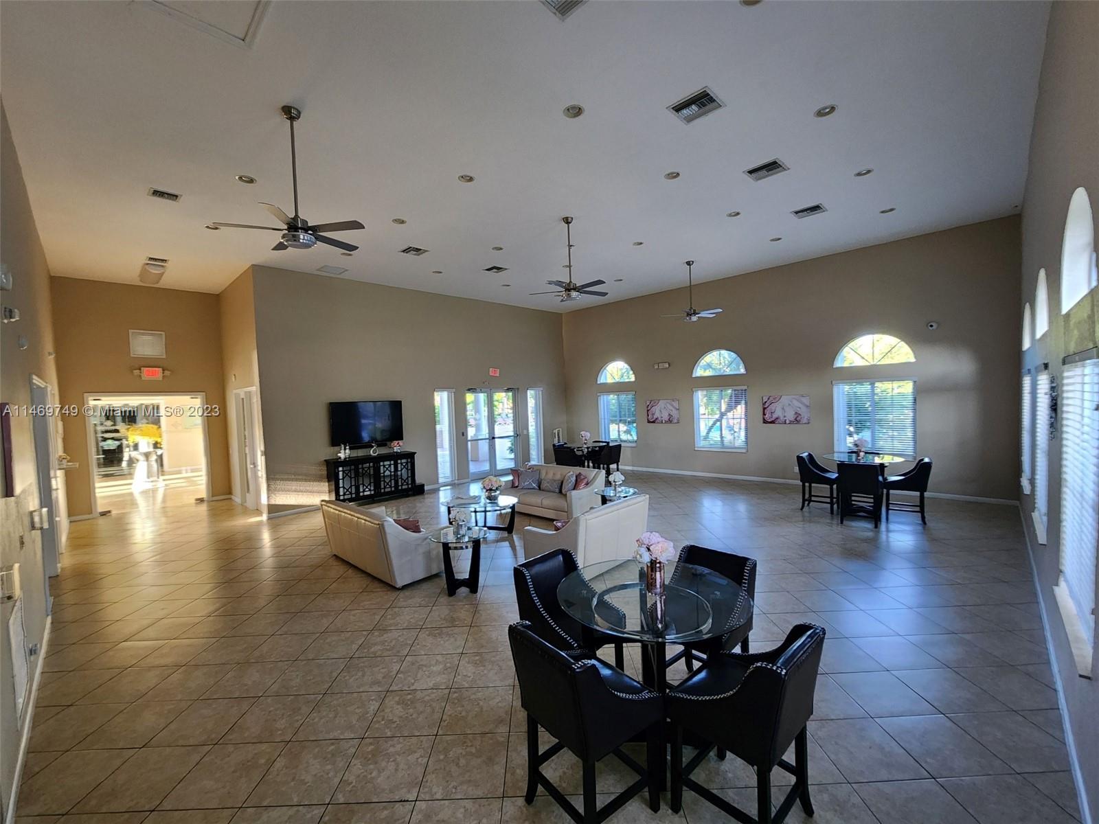 13986 Southwest 276th Street Homestead, FL 33032 - Photo 19 of 28 a living room with fireplace furniture and a wooden floor
