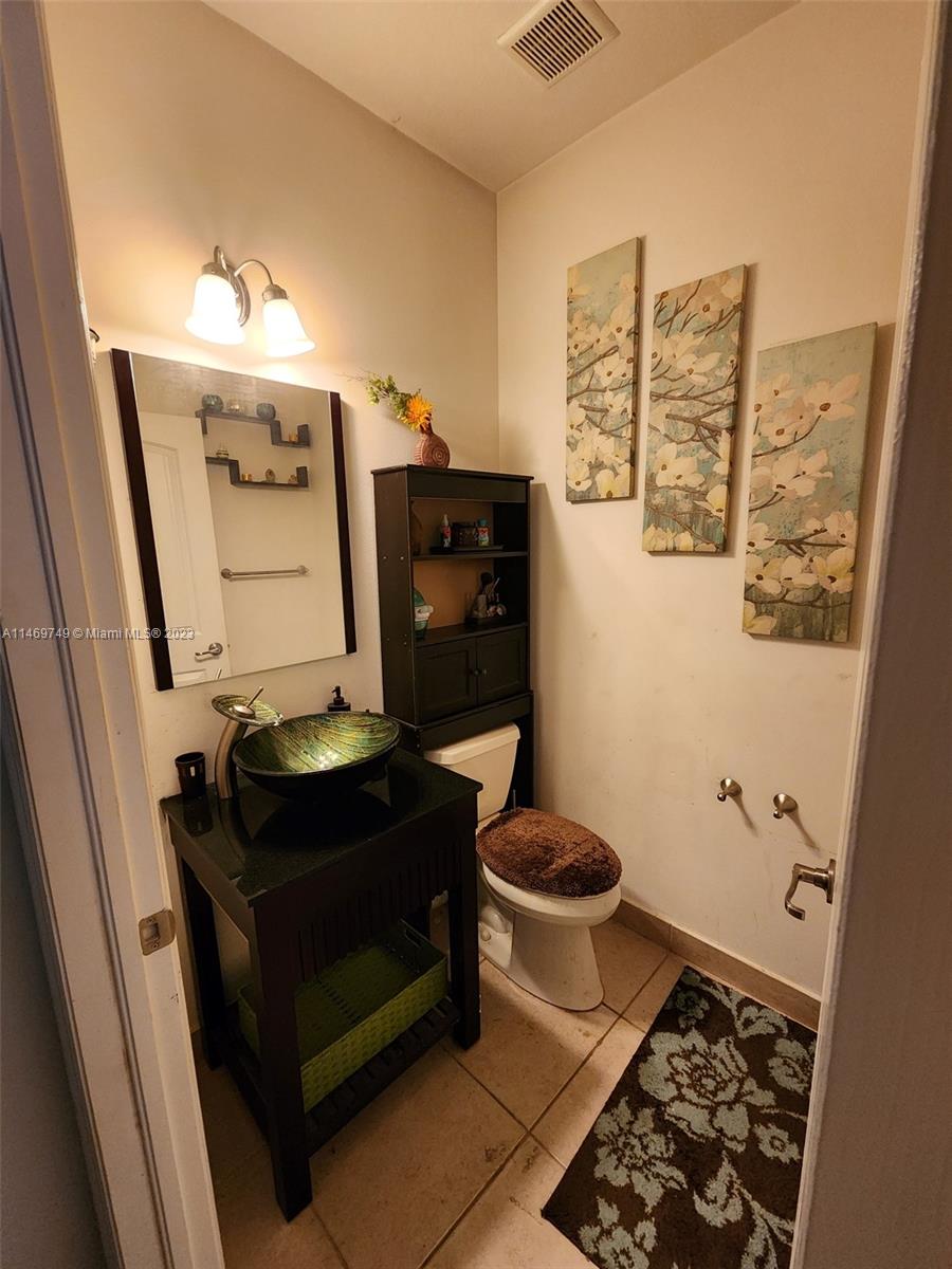 13986 Southwest 276th Street Homestead, FL 33032 - Photo 2 of 28 a bathroom with a toilet