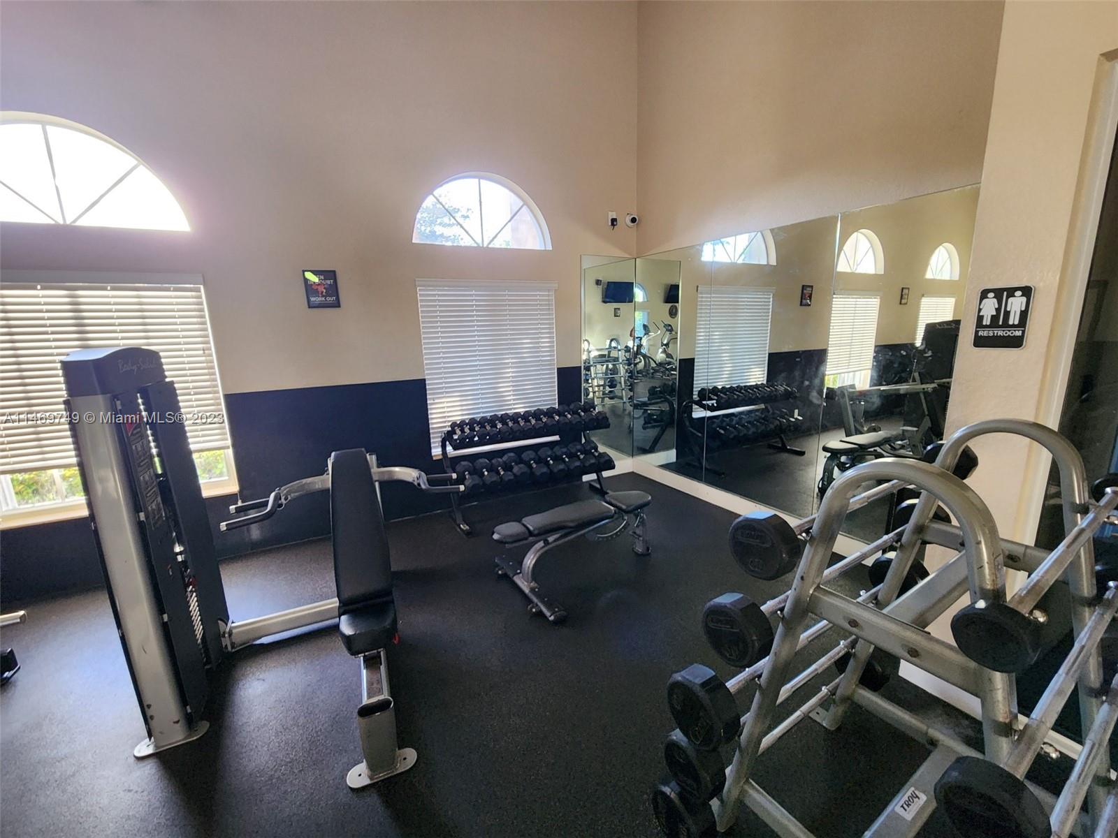 13986 Southwest 276th Street Homestead, FL 33032 - Photo 22 of 28 a view of a workspace with furniture and a window