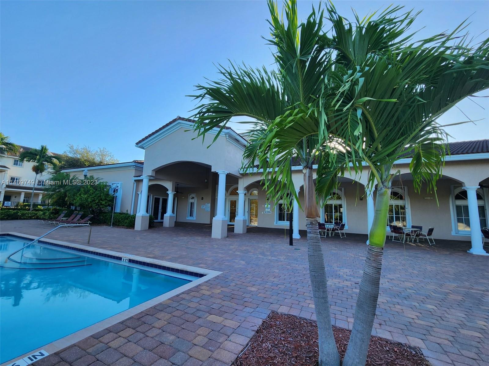 13986 Southwest 276th Street Homestead, FL 33032 - Photo 27 of 28 a view of a chairs and table in the patio
