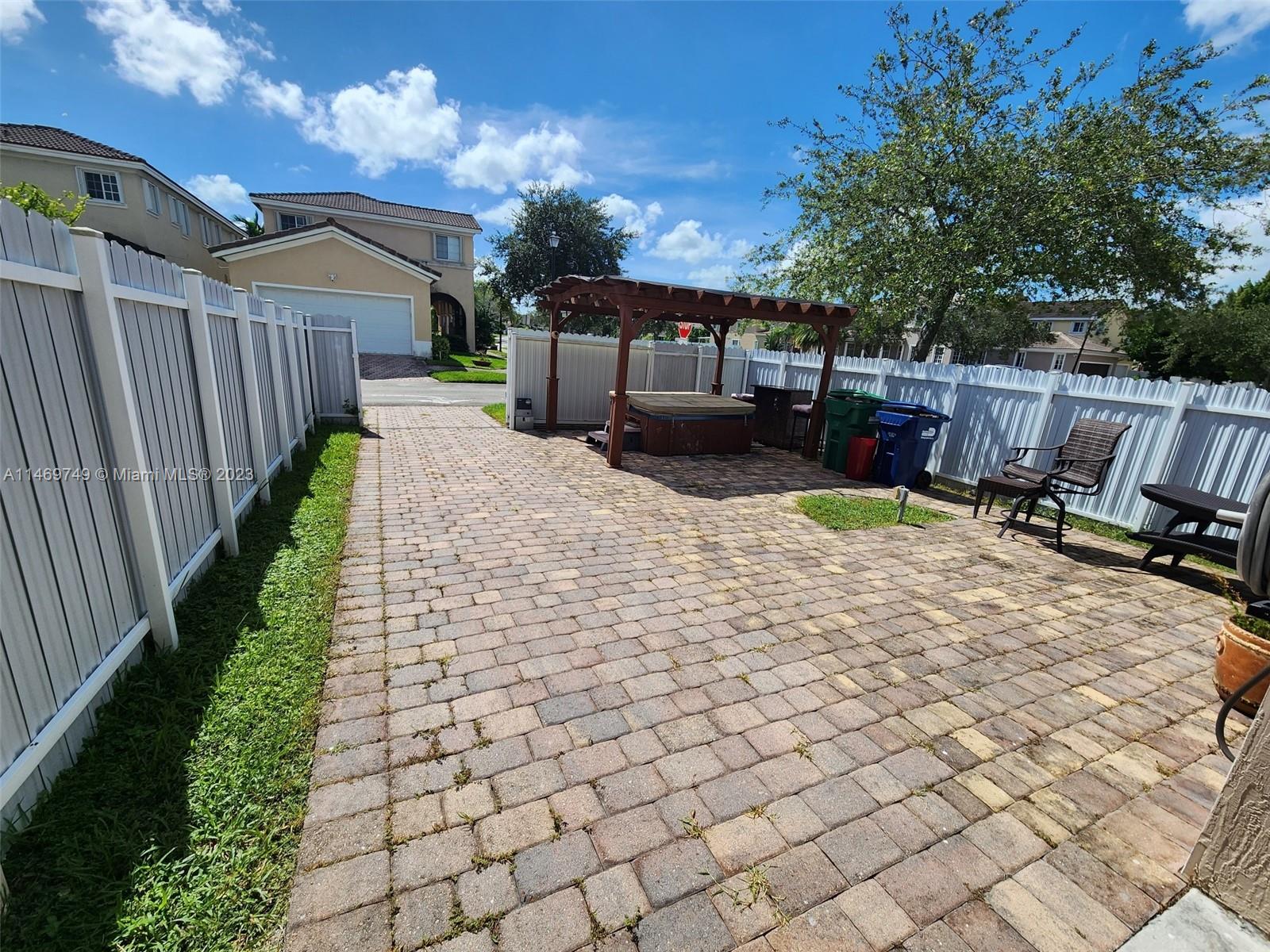 13986 Southwest 276th Street Homestead, FL 33032 - Photo 5 of 28 a view of a chairs and tables in the patio