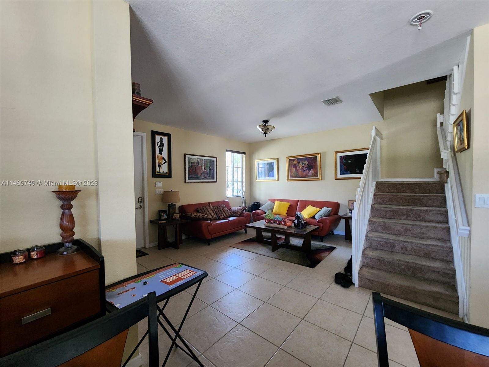 13986 Southwest 276th Street Homestead, FL 33032 - Photo 8 of 28 a living room with furniture and a window