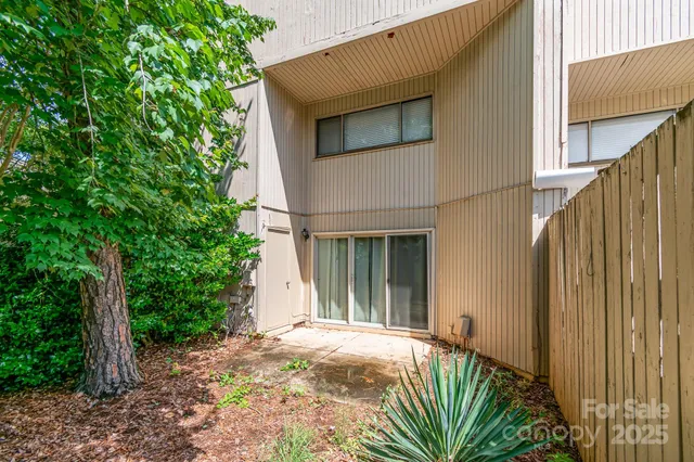 a garden with trees in front of it