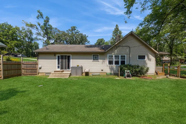 a front view of house with yard and outdoor seating