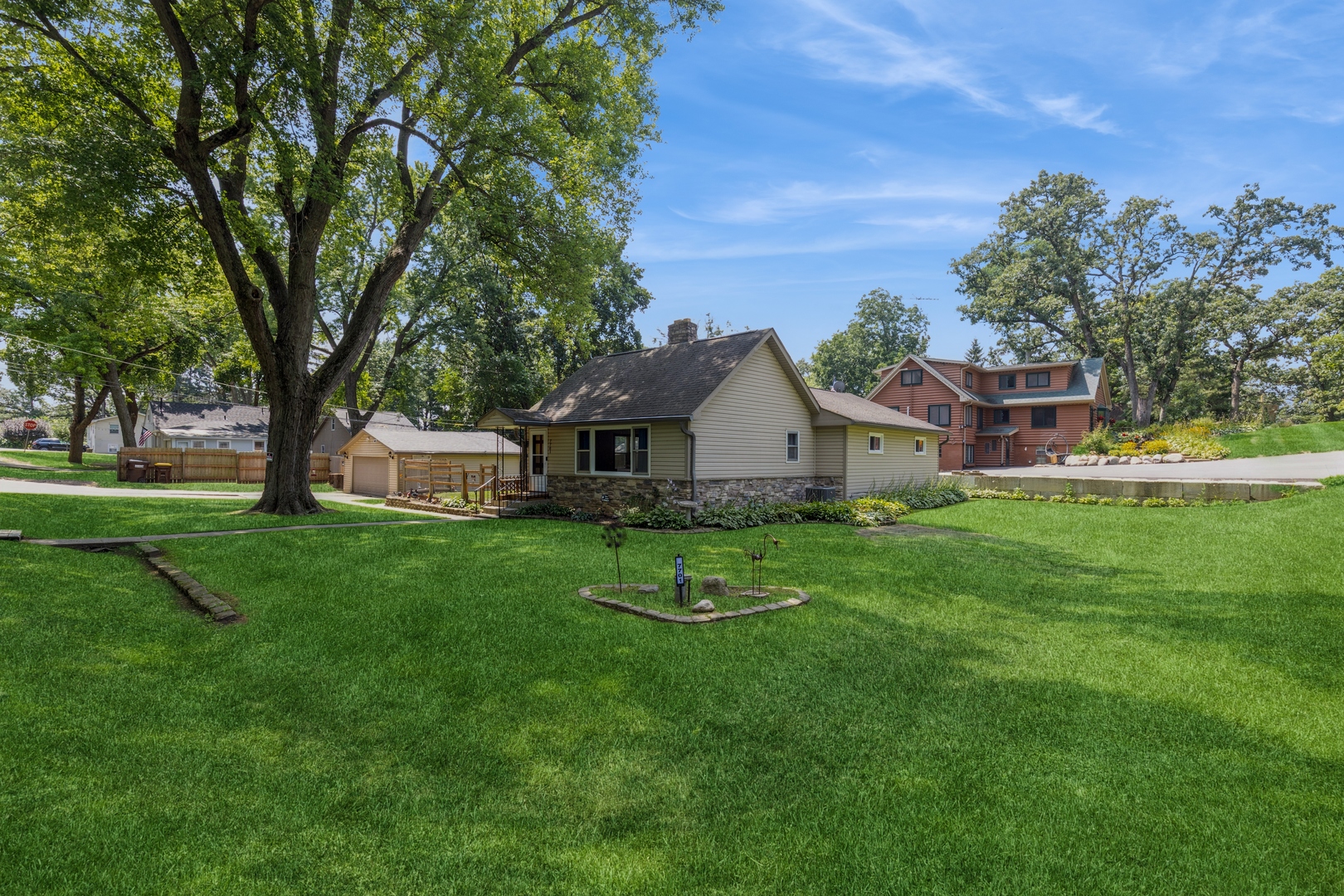 7701 Cedar Road Wonder Lake, IL 60097 - Photo 2 of 23 a front view of house with yard and green space