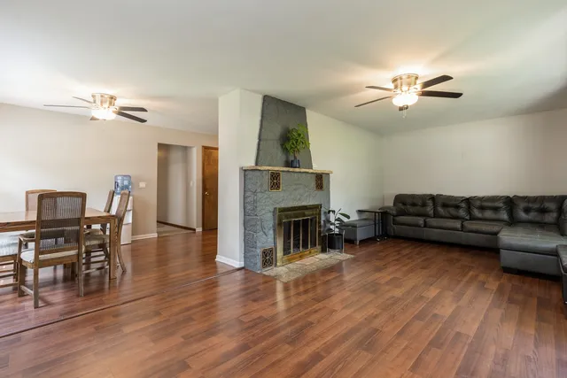 a living room with furniture and a fireplace