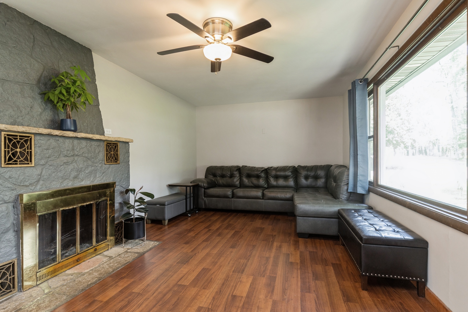 7701 Cedar Road Wonder Lake, IL 60097 - Photo 5 of 23 a living room with furniture and a fireplace