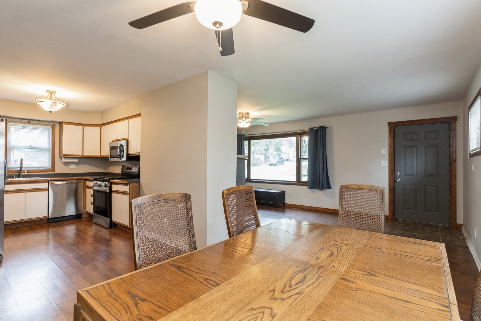 7701 Cedar Road Wonder Lake, IL 60097 - Photo 7 of 23 a living room with furniture and kitchen view