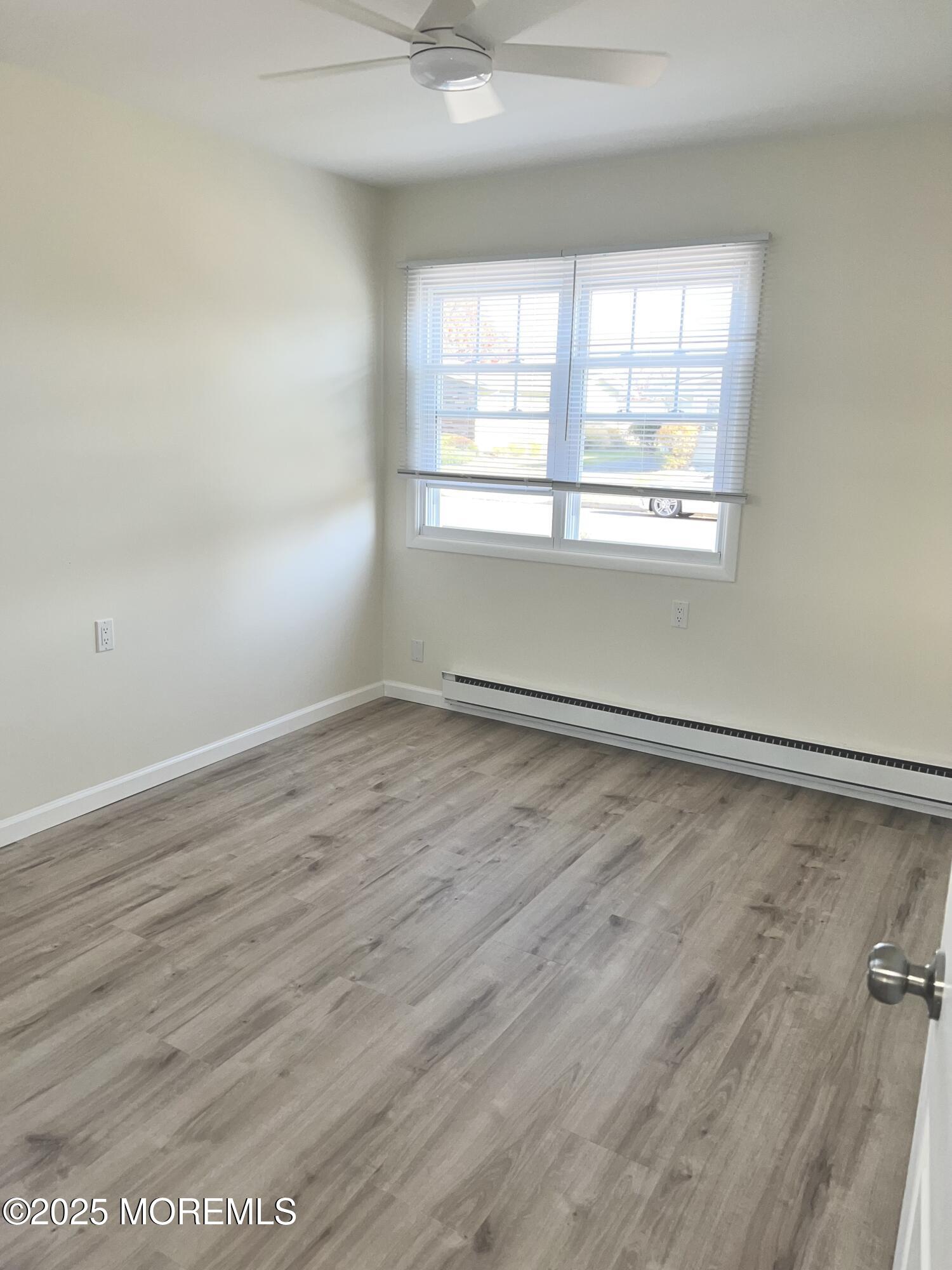 20 Lamb Road Brick, NJ 08724 - Photo 15 of 31 an empty room with wooden floor and windows