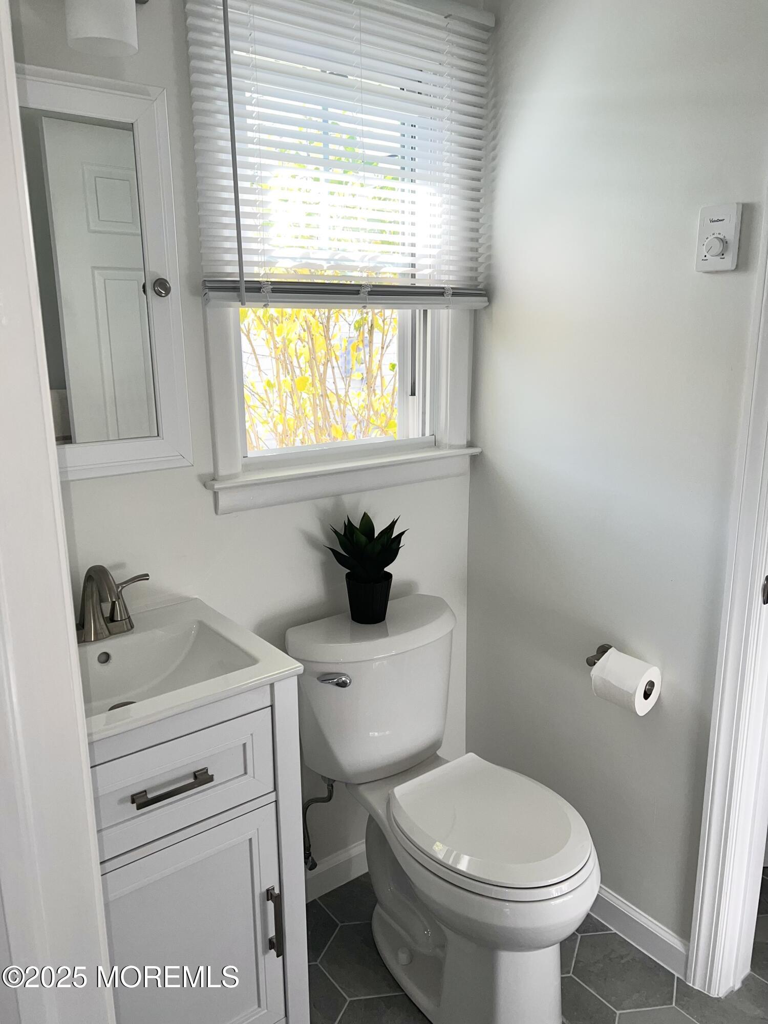 20 Lamb Road Brick, NJ 08724 - Photo 16 of 31 a bathroom with a sink toilet and window