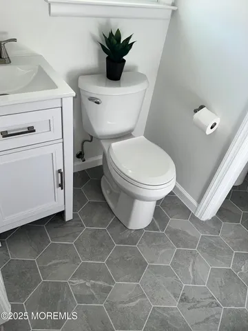 a bathroom with a toilet and a sink
