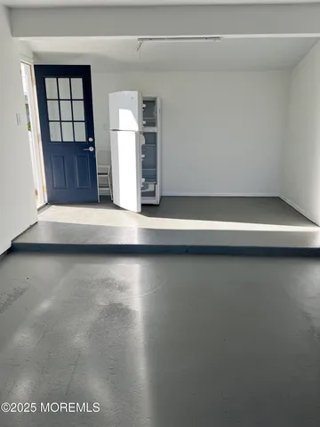 a view of wooden floor and windows in a room