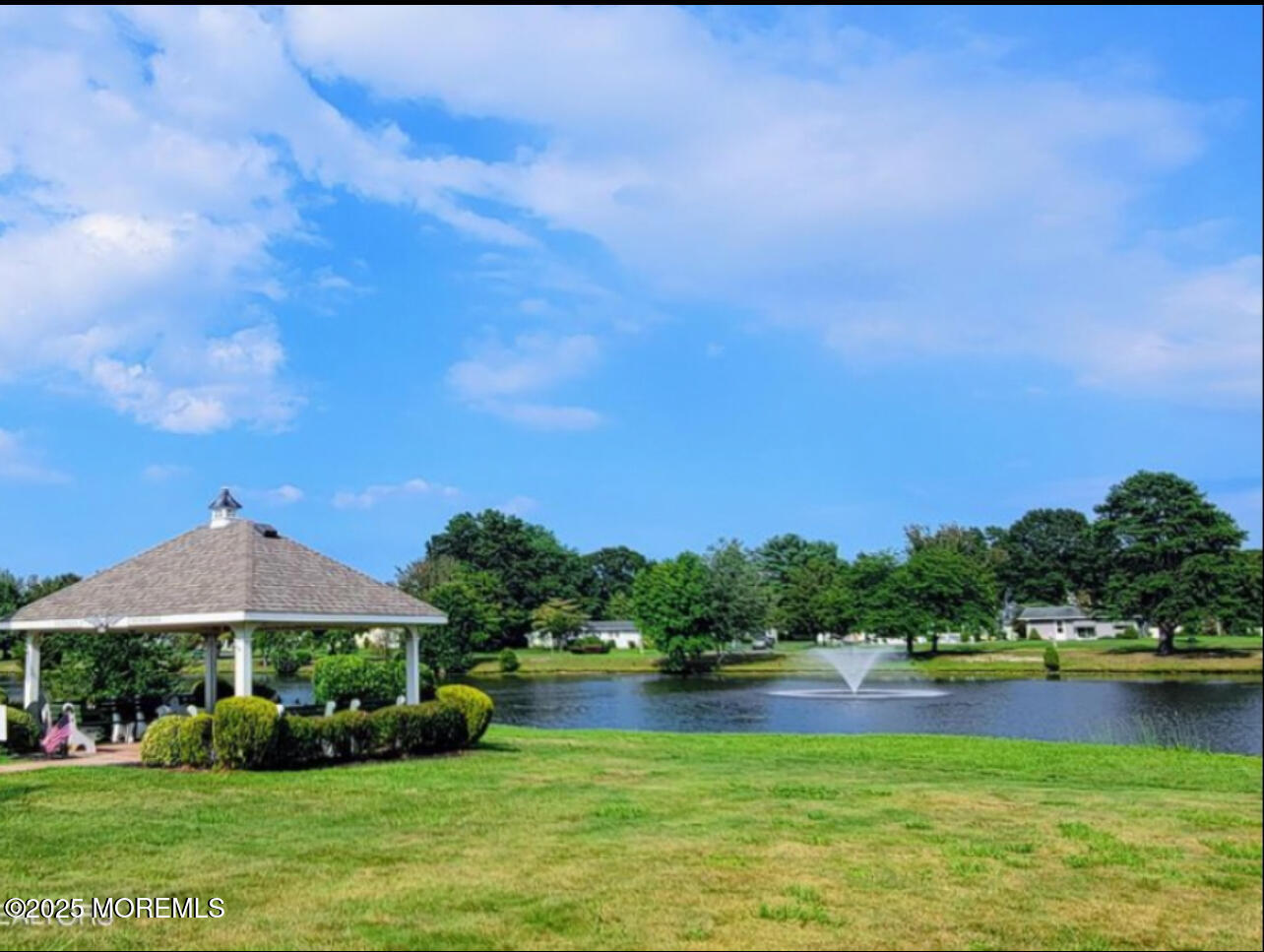 20 Lamb Road Brick, NJ 08724 - Photo 26 of 31 a view of a lake with a garden and houses