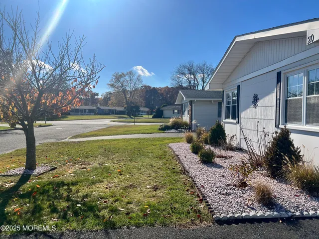 a view of a house with a big yard