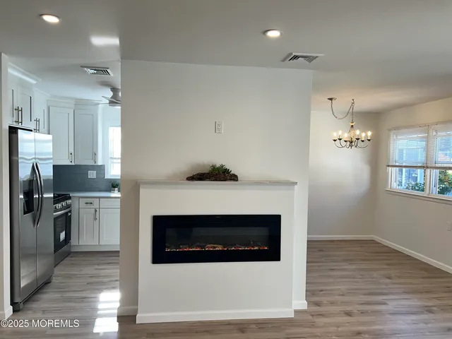 a kitchen with a stove and a refrigerator