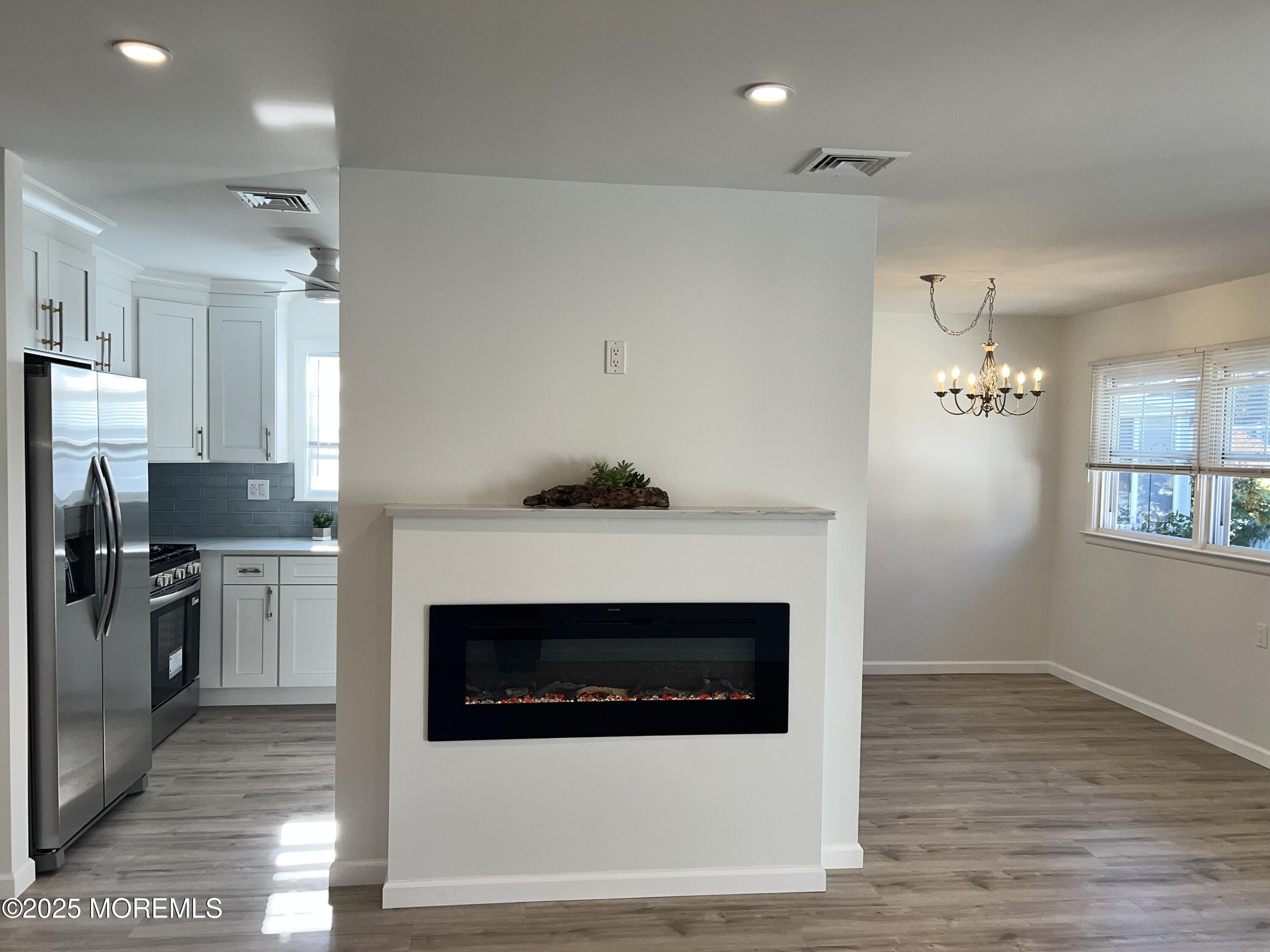 20 Lamb Road Brick, NJ 08724 - Photo 8 of 31 a kitchen with a stove and a refrigerator