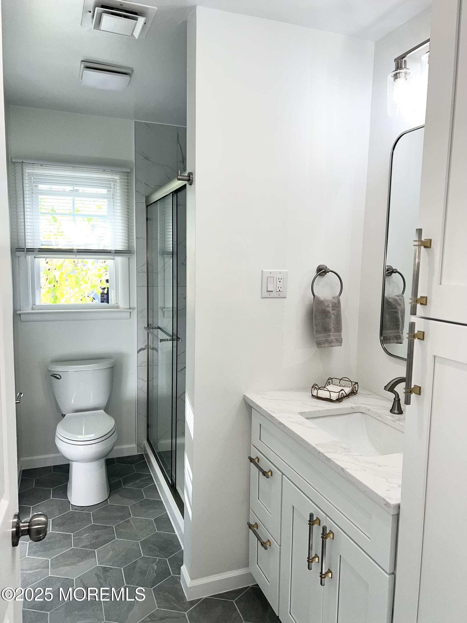 20 Lamb Road Brick, NJ 08724 - Photo 10 of 31 a bathroom with a sink toilet and shower