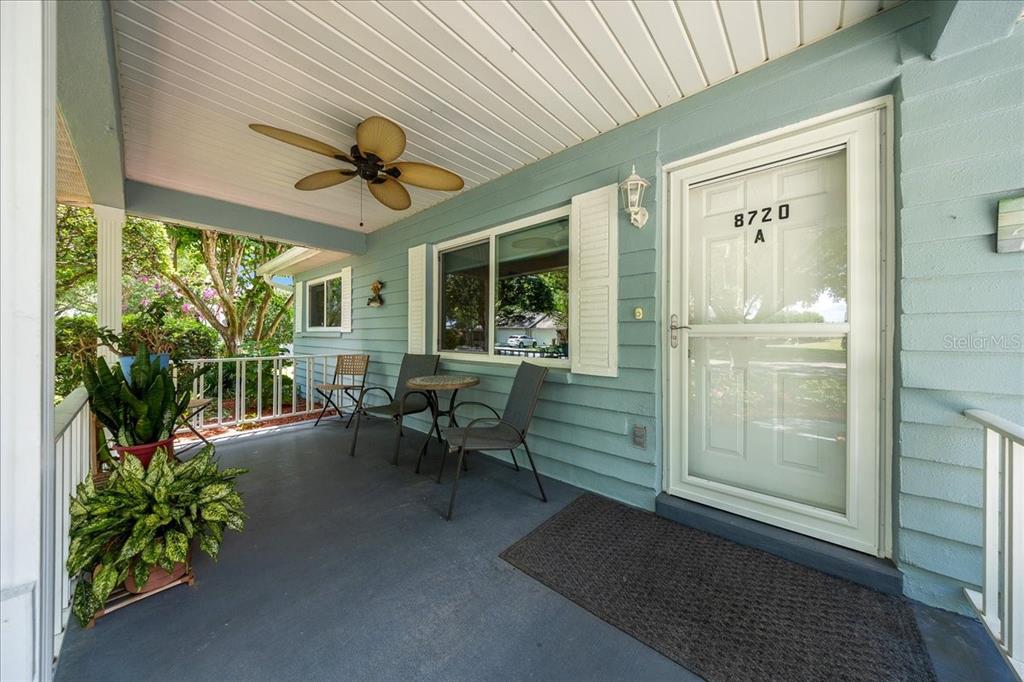 8720 Southwest 90th Street, Unit A Ocala, FL 34481 - Photo 4 of 71 a view of a porch with chairs and couches