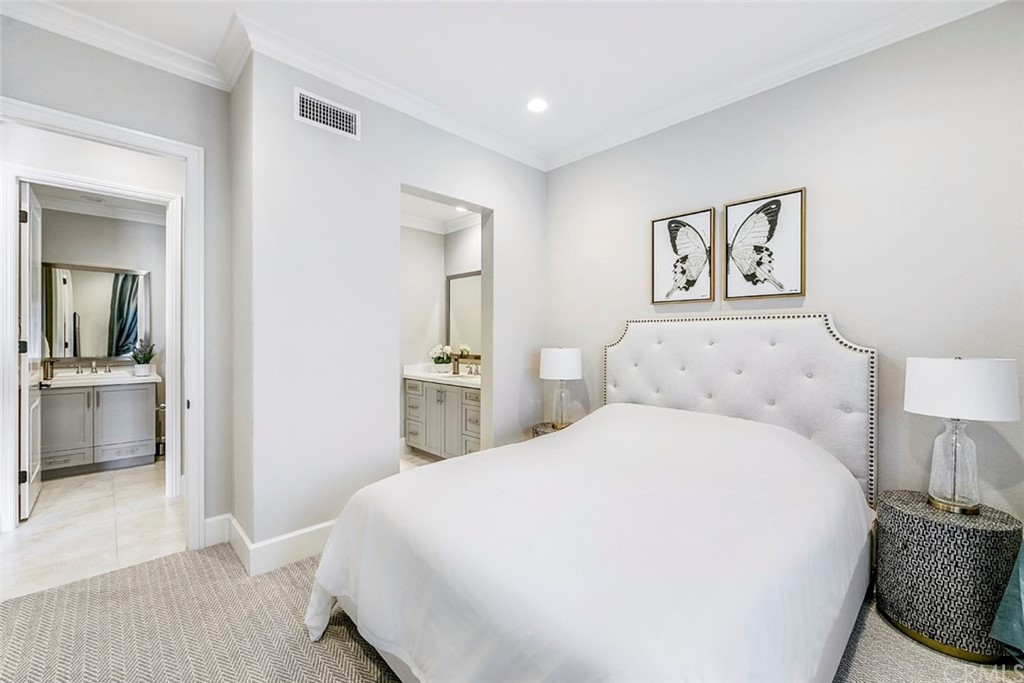 65 Rockinghorse Irvine, CA 92602 - Photo 16 of 51 a spacious bedroom with a bed and a view of bathroom