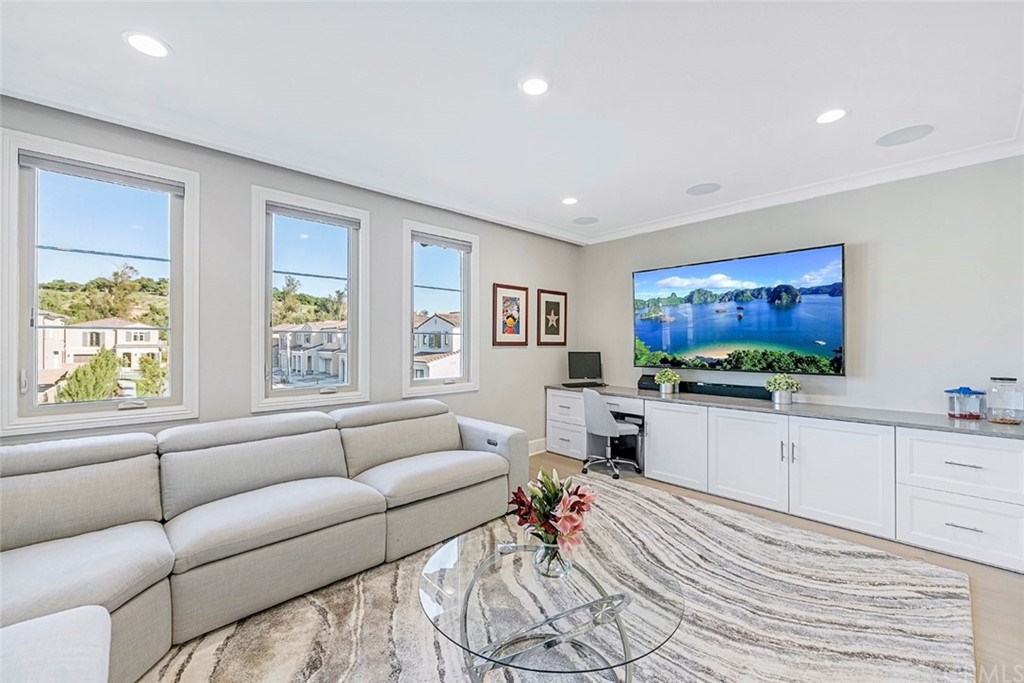 65 Rockinghorse Irvine, CA 92602 - Photo 21 of 51 a living room with furniture and a flat screen tv