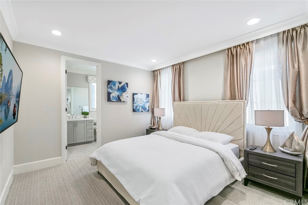 65 Rockinghorse Irvine, CA 92602 - Photo 31 of 51 a bedroom with a bed and a cabinets