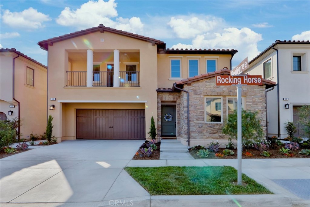 65 Rockinghorse Irvine, CA 92602 - Photo 38 of 51 a front view of a house with garden