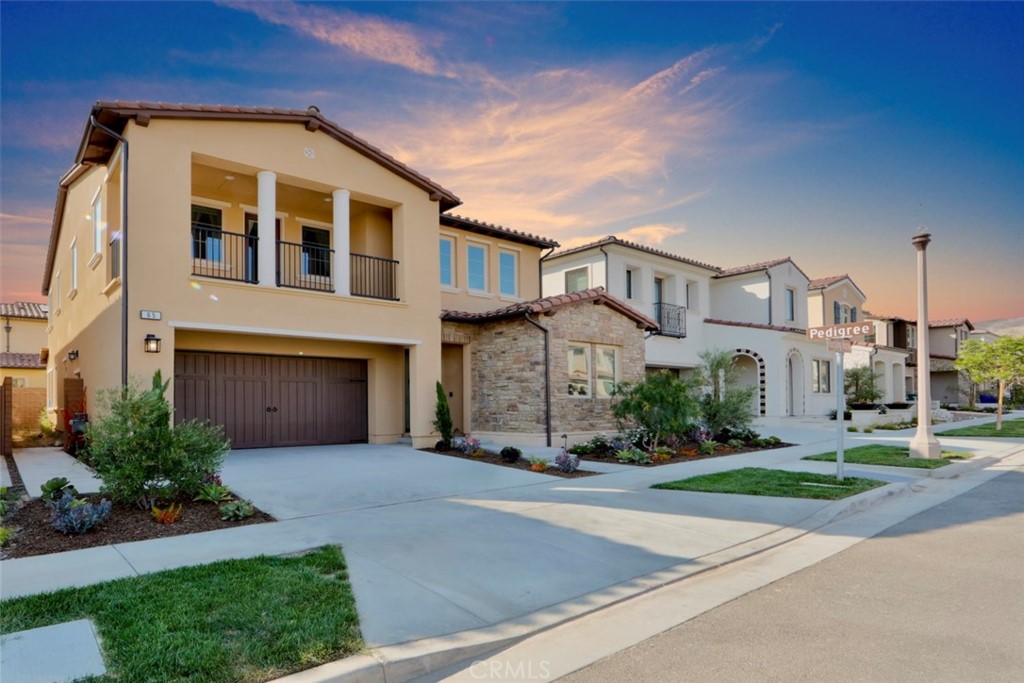 65 Rockinghorse Irvine, CA 92602 - Photo 41 of 51 a front view of a house with a yard and garage