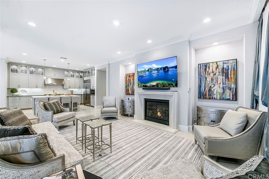 65 Rockinghorse Irvine, CA 92602 - Photo 6 of 51 a living room with furniture and a fireplace