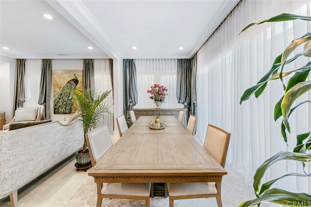 65 Rockinghorse Irvine, CA 92602 - Photo 7 of 51 a dining room with furniture a potted plant and a rug