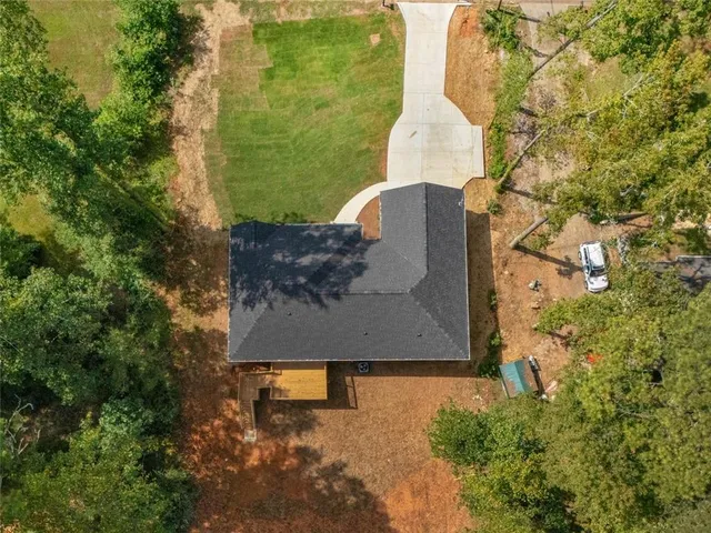 an aerial view of a residential houses with outdoor space