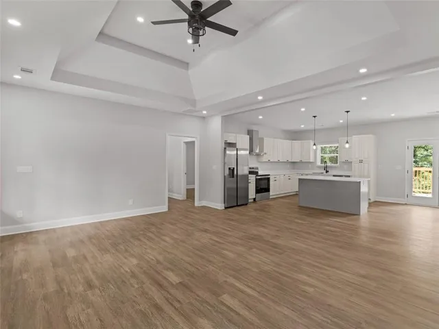 a view of a kitchen with a sink and a stove top oven
