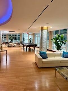 253 Northeast 2nd Street, Unit 224 Miami, FL 33132 - Photo 11 of 16 a living room with furniture and a large window