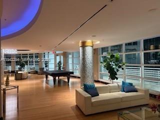 253 Northeast 2nd Street, Unit 224 Miami, FL 33132 - Photo 2 of 16 a living room with furniture and a potted plant