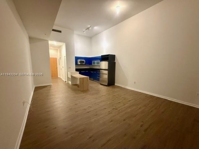 253 Northeast 2nd Street, Unit 224 Miami, FL 33132 - Photo 3 of 16 a view of a livingroom with wooden floor