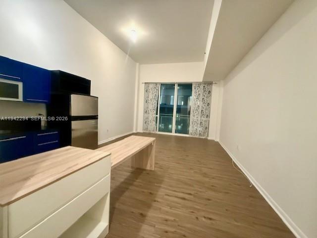 253 Northeast 2nd Street, Unit 224 Miami, FL 33132 - Photo 4 of 16 a kitchen with a stove and a refrigerator