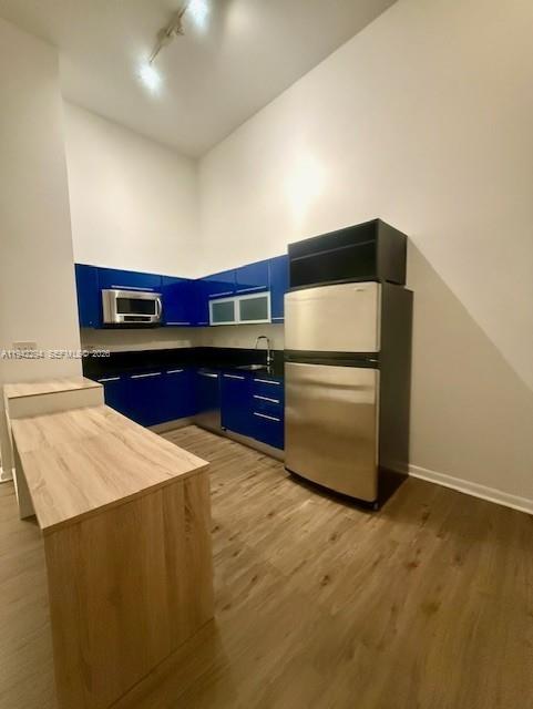 253 Northeast 2nd Street, Unit 224 Miami, FL 33132 - Photo 6 of 16 a kitchen with stainless steel appliances a refrigerator sink and stove