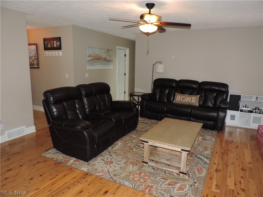 24770 Maple Ridge Road Westlake, OH 44145 - Photo 6 of 26 Living room with wood flooring and ceiling fan