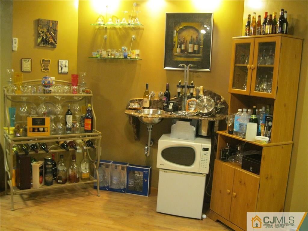 2201 Timber Ridge Court Sayreville, NJ 08859 - Photo 17 of 17 a utility room with sink dryer and washer