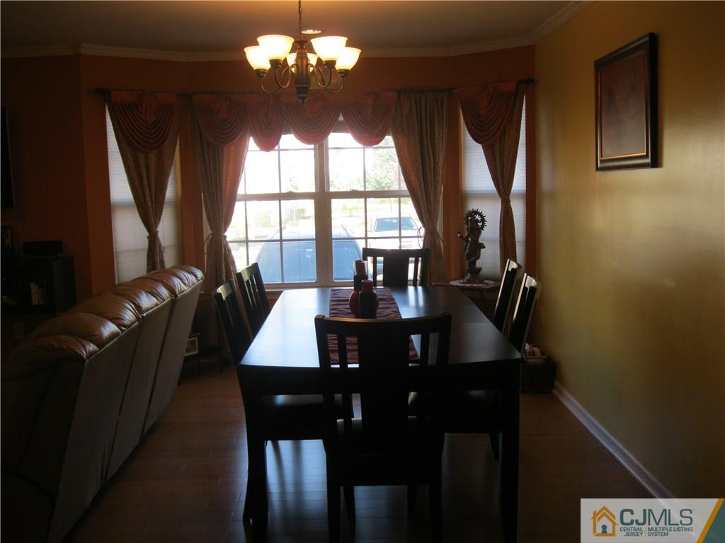 2201 Timber Ridge Court Sayreville, NJ 08859 - Photo 5 of 17 a view of a dining room with furniture and window