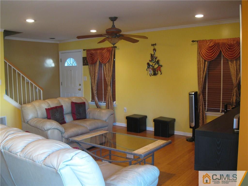 2201 Timber Ridge Court Sayreville, NJ 08859 - Photo 6 of 17 a living room with furniture and a flat screen tv