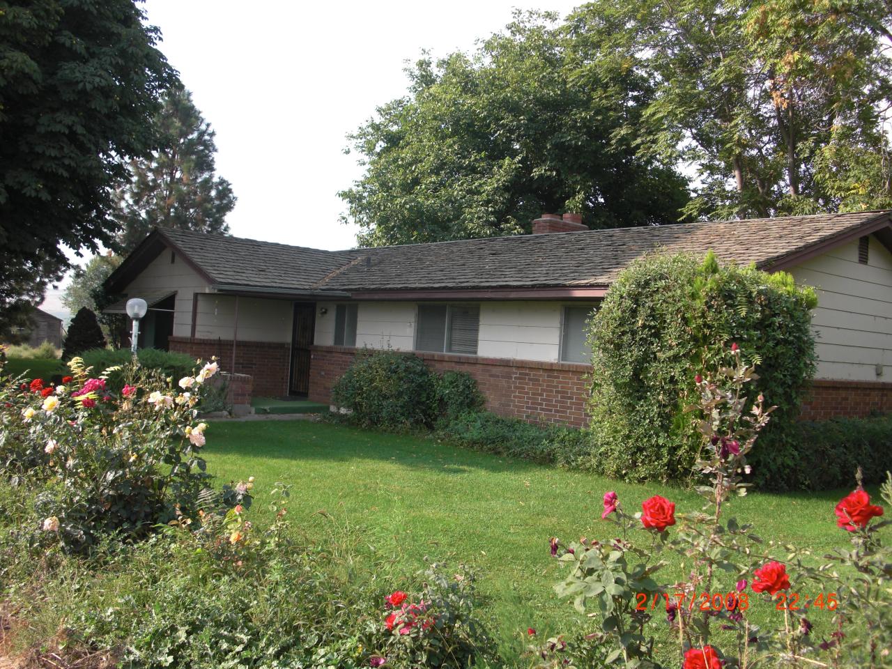 550 Wellner Road Outlook, WA 98938 - Photo 1 of 4 a front view of a house with a big yard and potted plants