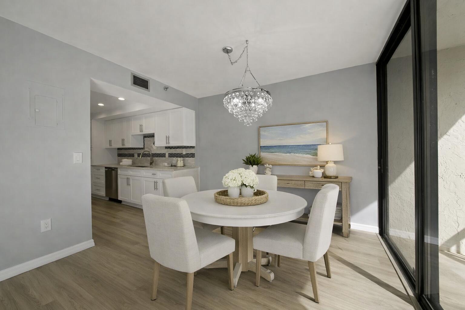 859 Jeffery Street, Unit 311 Boca Raton, FL 33487 - Photo 11 of 32 a view of a dining room with furniture and wooden floor
