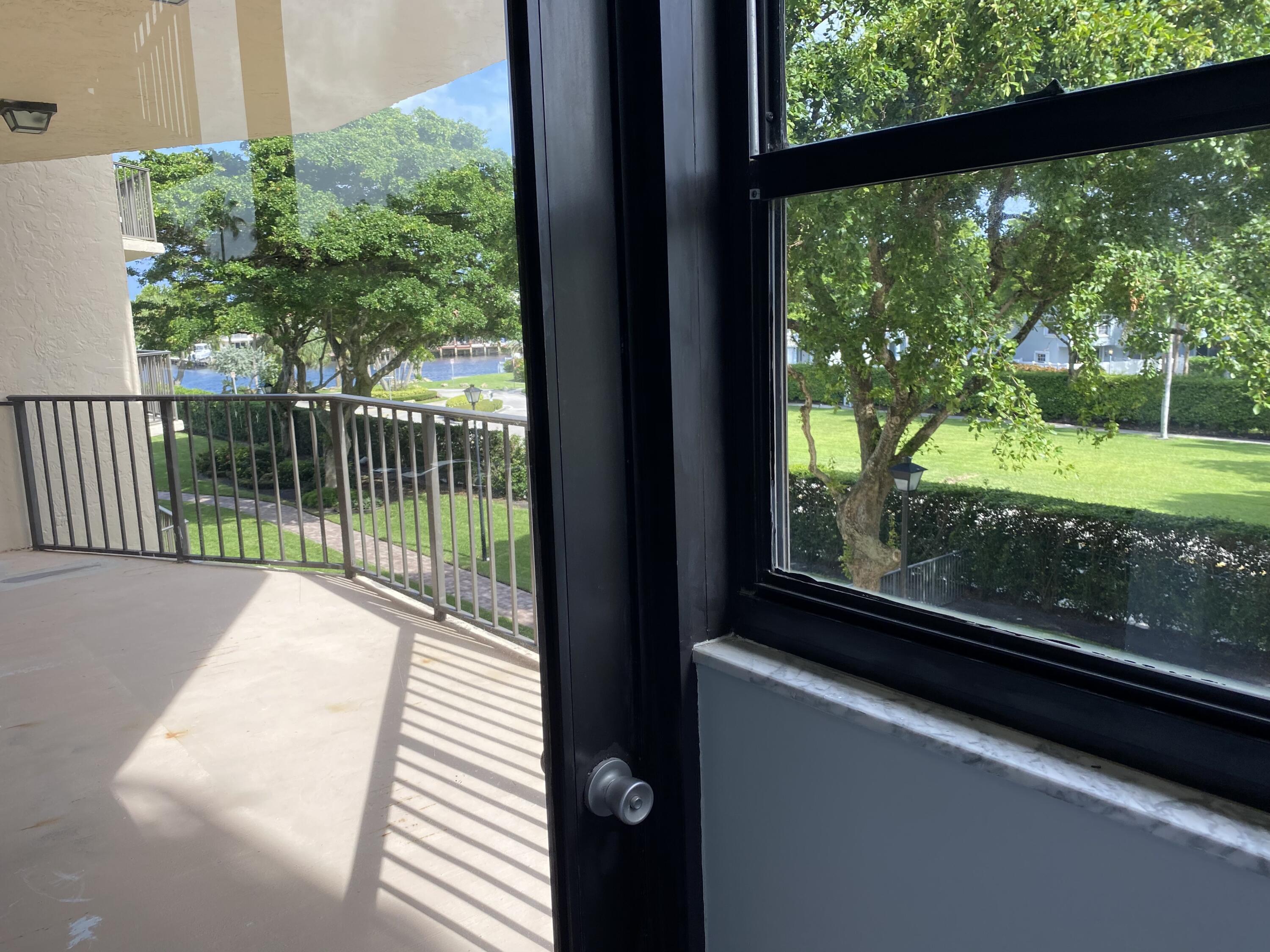 859 Jeffery Street, Unit 311 Boca Raton, FL 33487 - Photo 17 of 32 a view of a balcony with wooden floor