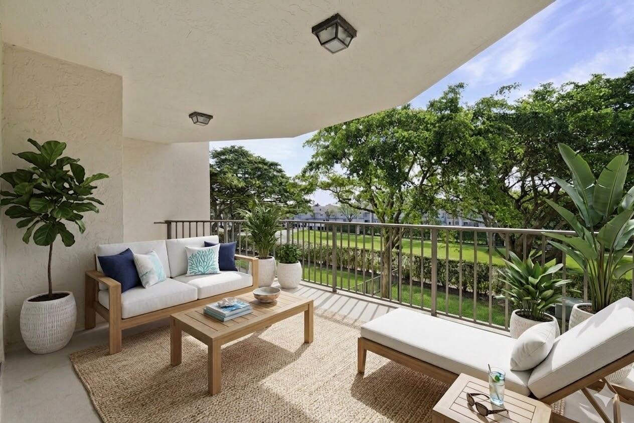 859 Jeffery Street, Unit 311 Boca Raton, FL 33487 - Photo 18 of 32 a outdoor living space with furniture and garden view