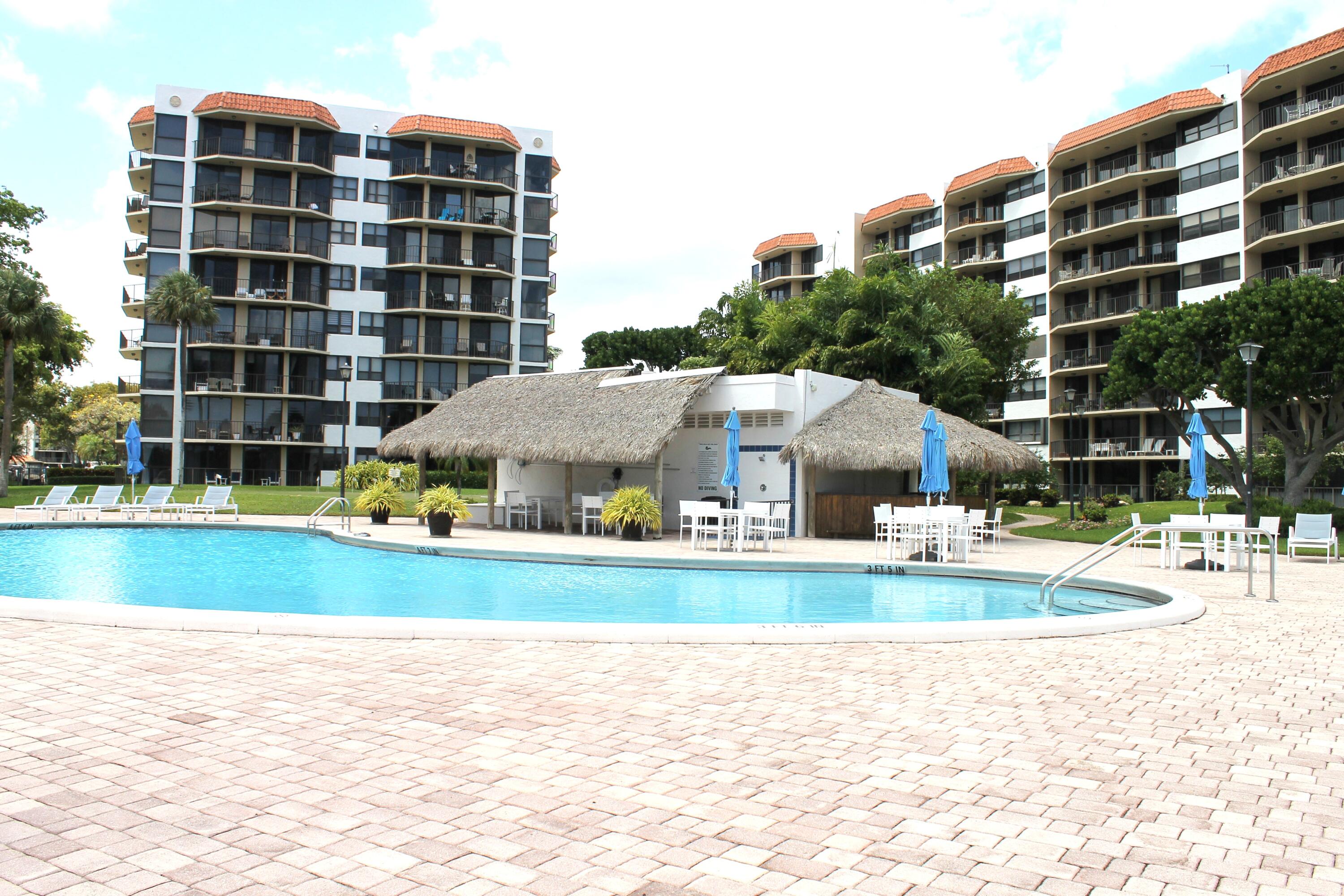859 Jeffery Street, Unit 311 Boca Raton, FL 33487 - Photo 22 of 32 a view of houses with outdoor space and swimming pool