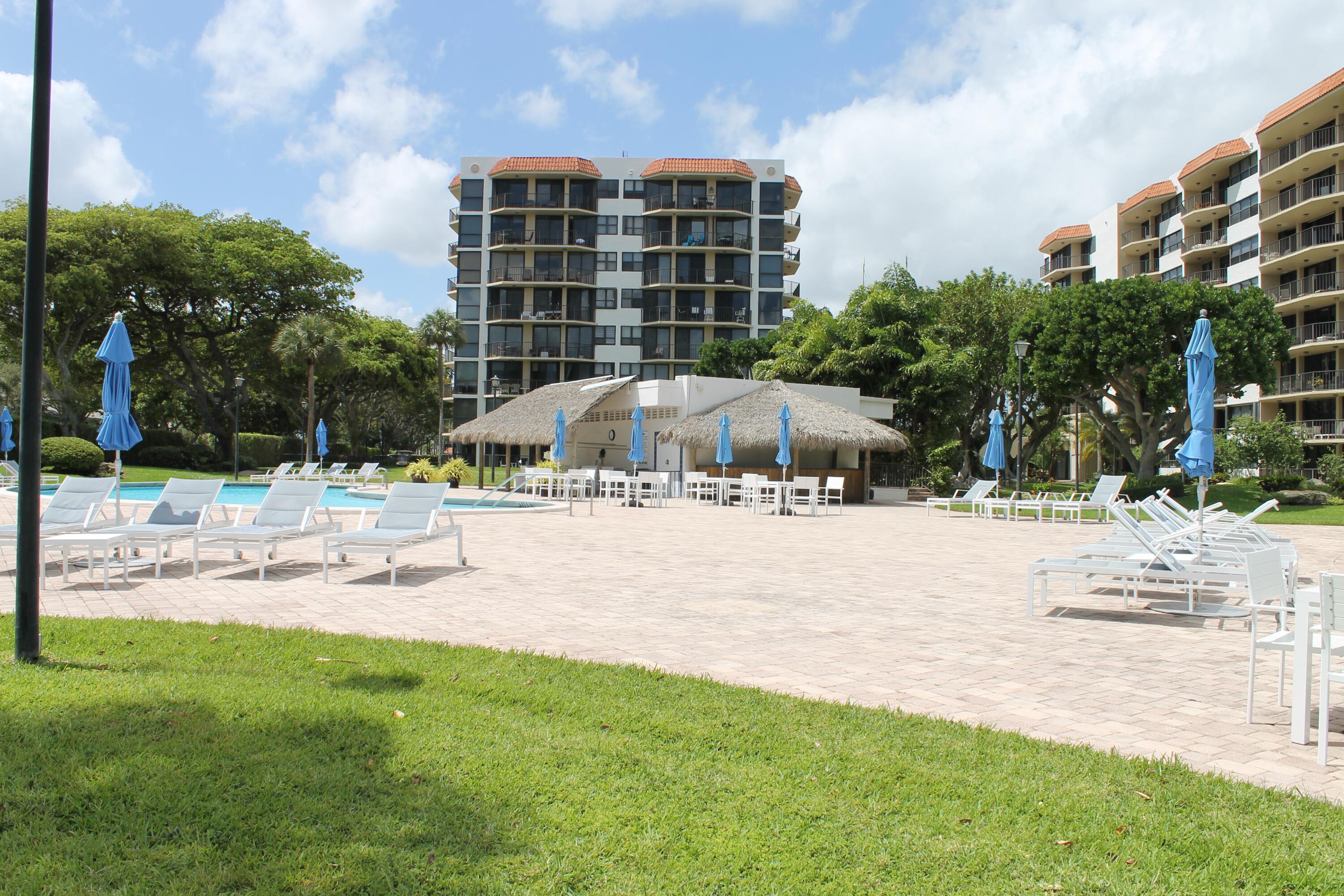 859 Jeffery Street, Unit 311 Boca Raton, FL 33487 - Photo 24 of 32 a view of the terrace with lawn chairs and plants