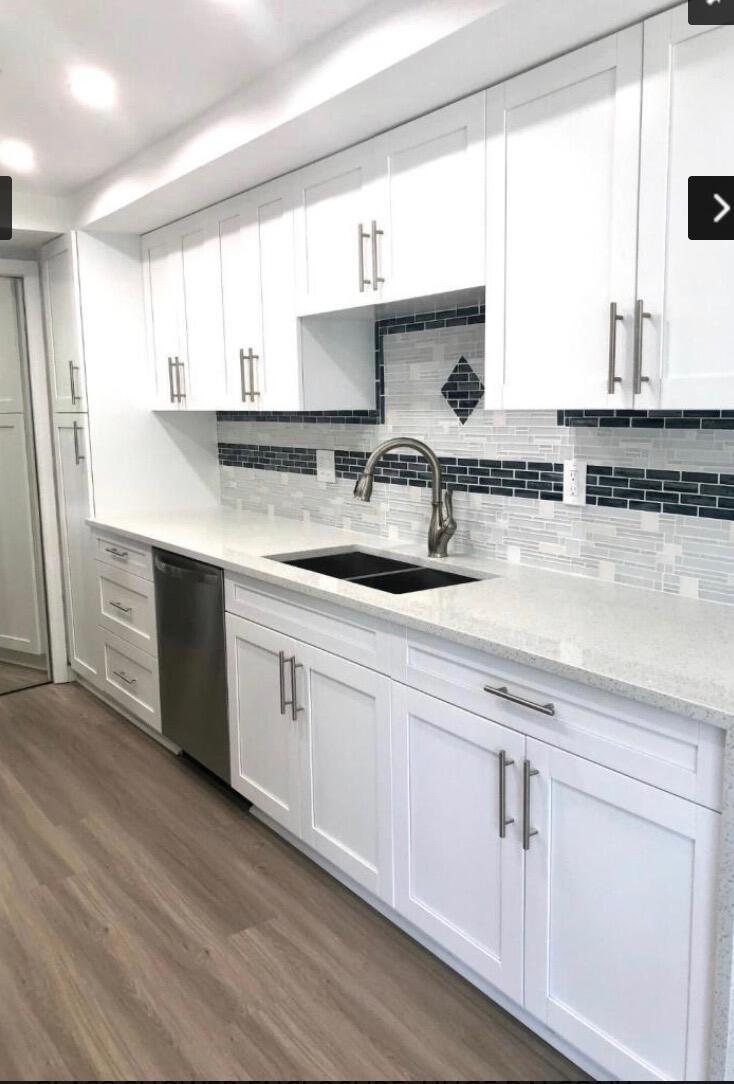 859 Jeffery Street, Unit 311 Boca Raton, FL 33487 - Photo 5 of 32 a kitchen with sink cabinets and window