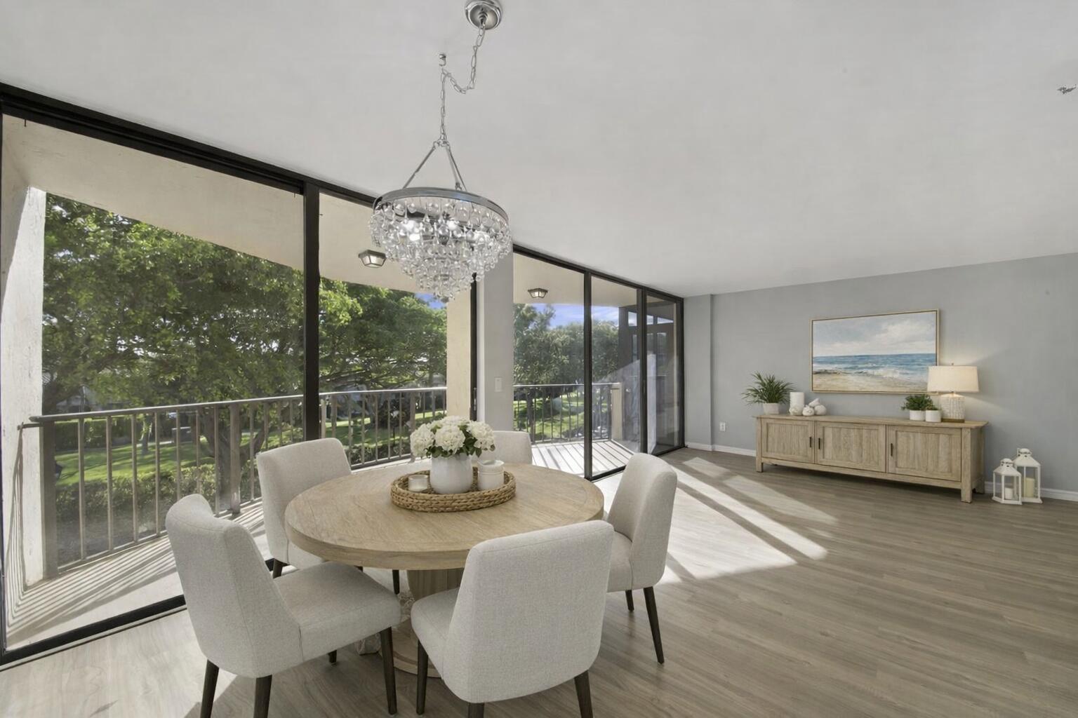 859 Jeffery Street, Unit 311 Boca Raton, FL 33487 - Photo 9 of 32 a view of a dining room with furniture window and wooden floor