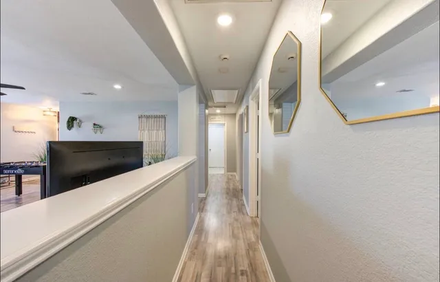 a bathroom with a granite countertop sink a toilet and shower