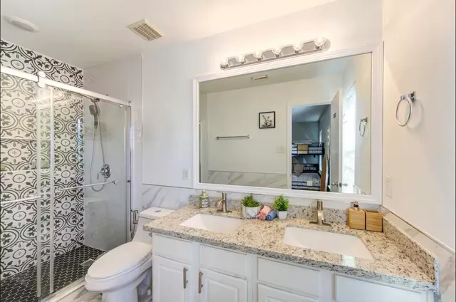 a bedroom with a bed couch and window